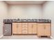 Close up of basement kitchenette with cabinets, countertop, sink and a mini-fridge at 4137 Clifton Ct, Boulder, CO 80301