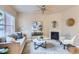 Cozy living room showcasing a fireplace, large window, and stylish furnishings at 4137 Clifton Ct, Boulder, CO 80301