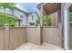 Private patio with wood fence and access to green space at 4137 Clifton Ct, Boulder, CO 80301