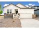 Stylish single-Gathering home with stone accents, a two car garage, and manicured gravel landscaping at 11124 Xanadu St, Commerce City, CO 80022