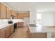 Bright kitchen featuring modern cabinets, stainless steel appliances, and a large island with a sink at 11124 Xanadu St, Commerce City, CO 80022