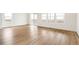 Bright living room with an abundance of natural light and access to the balcony at 11124 Xanadu St, Commerce City, CO 80022