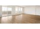 Bright living room with an abundance of natural light and access to the balcony at 11124 Xanadu St, Commerce City, CO 80022