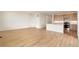 Bright living room with an open floor plan and a spacious kitchen area at 11124 Xanadu St, Commerce City, CO 80022