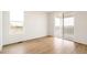 Bright living room with an abundance of natural light and access to the balcony at 11124 Xanadu St, Commerce City, CO 80022