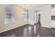 Dining room with hardwood floors and elegant chandelier near windows with natural light at 14176 Jackson St, Thornton, CO 80602