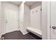 A home mudroom with hooks and bench seating near a door at 14176 Jackson St, Thornton, CO 80602