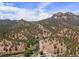 Breathtaking aerial view of a mountain landscape featuring a flowing river and scenic mountain vistas at 2230 S Platte River Rd, Sedalia, CO 80135