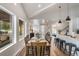 Bright and airy dining room with natural lighting, open layout, seamlessly connected to other living areas at 2230 S Platte River Rd, Sedalia, CO 80135