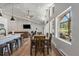 Bright dining area with large windows offering natural light and scenic views, open to the living space at 2230 S Platte River Rd, Sedalia, CO 80135