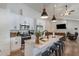 Modern kitchen featuring white cabinetry, stainless steel appliances, and a stylish island with seating at 2230 S Platte River Rd, Sedalia, CO 80135