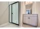 Modern bathroom featuring a glass-enclosed shower and updated vanity at 9627 Browns Peak Cir, Littleton, CO 80125