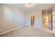 Bedroom features neutral walls, carpeted floor, with an en-suite bathroom and a walk-in closet at 9627 Browns Peak Cir, Littleton, CO 80125