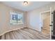Cozy bedroom with wood-style flooring and a window at 9627 Browns Peak Cir, Littleton, CO 80125
