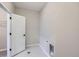Neutral laundry room with gray tile flooring and modern fixtures at 9627 Browns Peak Cir, Littleton, CO 80125