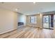 Spacious living room with modern fireplace and sliding glass doors at 9627 Browns Peak Cir, Littleton, CO 80125