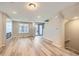 Bright living room featuring wood-style flooring, and large windows at 9627 Browns Peak Cir, Littleton, CO 80125