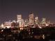 Night panoramic view of Denver skyline featuring illuminated buildings and vibrant city lights at 1085 N Lafayette St # 704, Denver, CO 80218