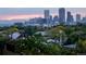 Breathtaking city view featuring the Denver skyline with tree lined streets in the foreground at 1085 N Lafayette St # 704, Denver, CO 80218