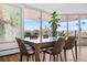 Bright dining room features stylish table, chairs and sliding glass door leading to balcony at 1085 N Lafayette St # 704, Denver, CO 80218