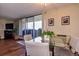 Bright dining space featuring glass table, comfortable seating, and balcony access with city views at 1085 N Lafayette St # 704, Denver, CO 80218