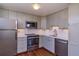 Modern kitchen with stainless steel appliances, sleek cabinetry, and ample counter space at 1085 N Lafayette St # 704, Denver, CO 80218