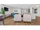 Open concept living area with stylish furnishings and a view into the connected kitchen area at 1085 N Lafayette St # 704, Denver, CO 80218