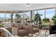 Bright living room with floor-to-ceiling windows and city views, featuring modern furniture at 1085 N Lafayette St # 704, Denver, CO 80218