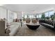 Bright and airy living room with floor-to-ceiling windows and contemporary decor at 1085 N Lafayette St # 704, Denver, CO 80218