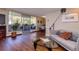Cozy living room boasting hardwood floors, modern sofa, and sliding glass door to balcony at 1085 N Lafayette St # 704, Denver, CO 80218