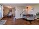 Inviting living room with hardwood floors and a dining area beyond an open partition wall at 1085 N Lafayette St # 704, Denver, CO 80218