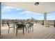 Outdoor patio with city views, metal table, and chairs, perfect for entertaining at 1085 N Lafayette St # 704, Denver, CO 80218