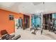 Basement gym with workout equipment, mirrors and colorful walls at 13421 Humboldt Way, Thornton, CO 80241