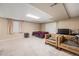 Finished basement featuring carpeted floors, a bed, couches and a closet at 13421 Humboldt Way, Thornton, CO 80241