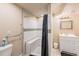 Bathroom featuring a shower with a bench, sleek vanity and neutral paint at 13421 Humboldt Way, Thornton, CO 80241