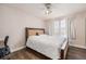 Bedroom with wood floors, a ceiling fan and a large window for natural light at 13421 Humboldt Way, Thornton, CO 80241