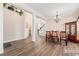 Elegant dining room with wood floors, decorative chandelier, and plenty of natural light at 13421 Humboldt Way, Thornton, CO 80241