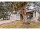 Two-story home featuring a two-car garage, inviting front porch, and beautifully landscaped yard at 13421 Humboldt Way, Thornton, CO 80241