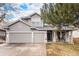 Charming two-story home with a well-manicured lawn, attached two-car garage, and welcoming front porch at 13421 Humboldt Way, Thornton, CO 80241