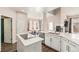 Open kitchen with stainless appliances, quartz countertops, island with cooktop and a breakfast nook at 13421 Humboldt Way, Thornton, CO 80241