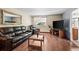 Comfortable living room with hardwood floors, plush seating, and bright natural light at 5338 Granby St, Denver, CO 80239