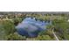 Calm pond reflecting the sky, surrounded by lush greenery and a walking path at 5338 Granby St, Denver, CO 80239