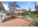 Backyard features a large brick patio with a wooden picnic table and shade at 3368 S Corona St, Englewood, CO 80113