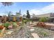 Landscaped backyard with gravel, picnic table, shade structure, and small building at 3368 S Corona St, Englewood, CO 80113