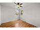 Minimalist bedroom featuring hardwood floors, neutral walls, and windows providing natural light at 3368 S Corona St, Englewood, CO 80113