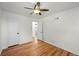 Bedroom with hardwood floors, ceiling fan, and closet, offering ample space at 3368 S Corona St, Englewood, CO 80113