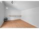 Simple bedroom features wood laminate floors, built in desk, and white walls at 3368 S Corona St, Englewood, CO 80113