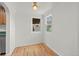 Cozy dining area boasts hardwood floors and natural light from two windows at 3368 S Corona St, Englewood, CO 80113