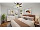 Stylishly furnished main bedroom with hardwood floors, ample natural light, and modern decor at 3368 S Corona St, Englewood, CO 80113