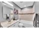 Well-lit bathroom with white vanity, shower-tub combination with modern tile at 7902 Meade St # A10, Westminster, CO 80030